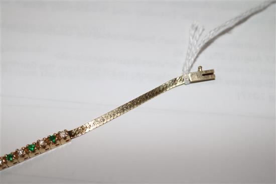 A 14ct gold, emerald and diamond small line bracelet, 15cm.